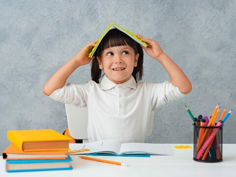 back-school-cute-child-schoolgirl-sitting-desk-room_3