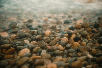 stones on the shore hitting by waves