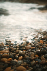 stones on the shore hitting by waves