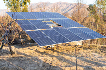 Solar panels in agriculture farm for generating renewable energy to use for irrigation in Pakistan - obrazy, fototapety, plakaty