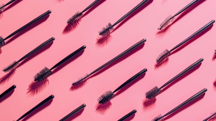 Diverse array of mascaras brush on pink background