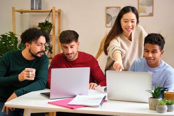 Asian female student explaining her colleagues the university lesson at shared flat.