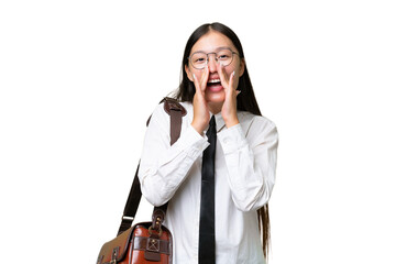 Young Asian business woman over isolated background shouting and announcing something