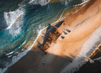 K'gari High angle aerial bird's eye drone view of the Maheno shipwreck on Seventy-Five Mile Beach...