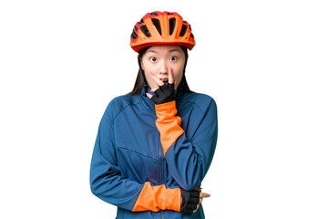 Young cyclist woman over isolated chroma key background surprised and shocked while looking right - obrazy, fototapety, plakaty
