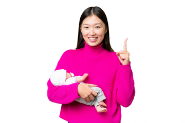Young Asian woman with her newborn baby over isolated chroma key background pointing up a great idea