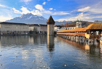 Marvelous historic city center of Lucerne with the old wooden Chapel Bridge (Kapellbruecke) and the old Water Tower (Wasserturm). Lucerne, Switzerland, Europe. 