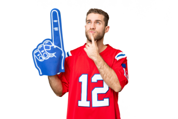 sports fan man over isolated chroma key background having doubts while looking up