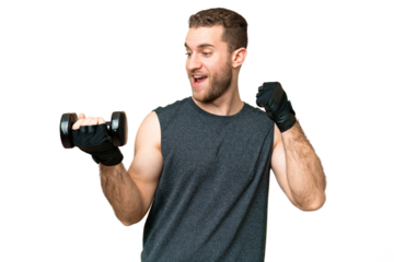 Young sport man making weightlifting over isolated chroma key background celebrating a victory