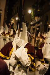 Hooded penitents during the famous Good Friday procession in Chieti (Italy) - 784629671