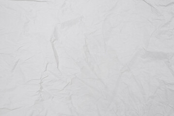 Crumpled white paper background.