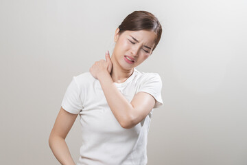 Pain body muscles stiff problem, asian young woman, girl painful with back, neck ache from work hand holding massaging rubbing shoulder hurt, sore on white background. Health care and medicine concept