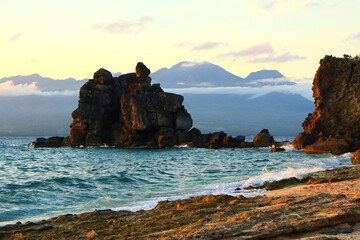 Evening seascape, travel photography. Secluded bay with waves and ocean, formations of the rocks....