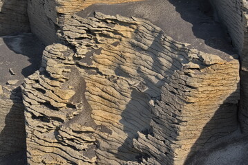 Russia. The Far East. The unique texture of the coastal rocks of Iturup Island, caused by the influence of the salt water of the Sea of Okhotsk.