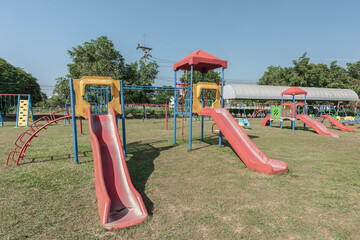 Playground in the park with blue sky - 784642491