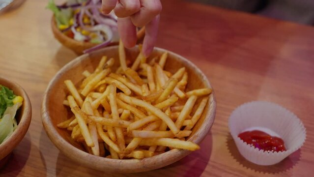 French fries in the wooden bowl