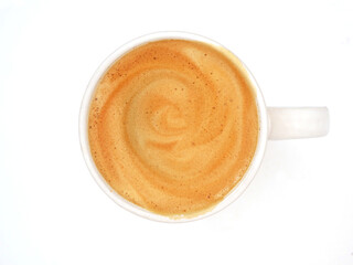 Freshly brewed coffee with velvety foam served in a small white cup with ears. White background. Top view. 