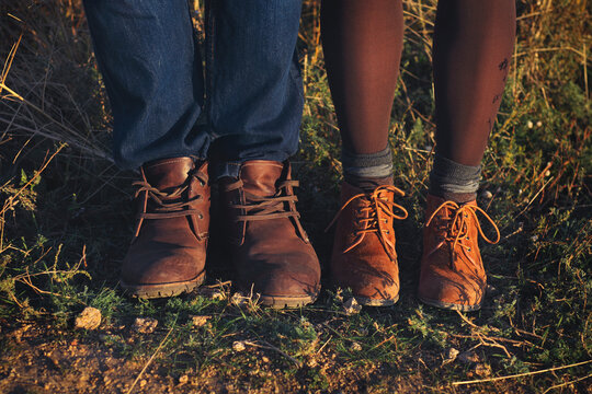 Couple man and woman feet in love romantic outdoor with autumn season nature on background
