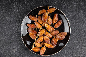 date on a branch dried sweet fruit fresh appetizer meal food snack on the table copy space food background rustic top view