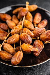date on a branch dried sweet fruit fresh appetizer meal food snack on the table copy space food background rustic top view
