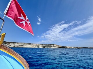 Malta flag in the wind. Sunny day - 784658637