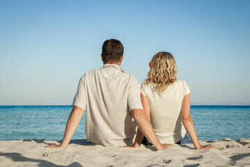 happy loving couple by the sea in the nature