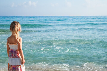 Fototapeta na wymiar happy child playing by the sea outdoors