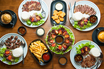 Top view of Western and Asian food mixing on wood table