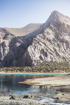 Mountain panorama landscape with rocky peaks and lake in the morning in the Fan Mountains in Tajikistan