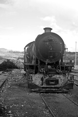 abandoned rusty locomotive on a track