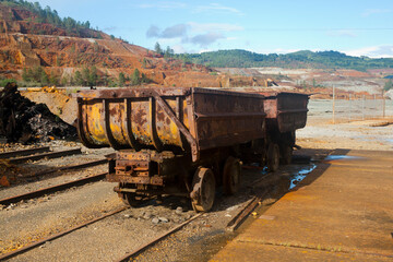 rusty mine cart abandoned on a track