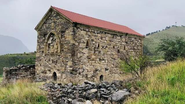 Thaba-Yerdy in Ingushetia. ZEISS, RUSSIA - MAY 19, 2023: Video of the Thaba-Yerdy Temple, the oldest temple in Ingushetia. The Caucasus Mountains. 4K