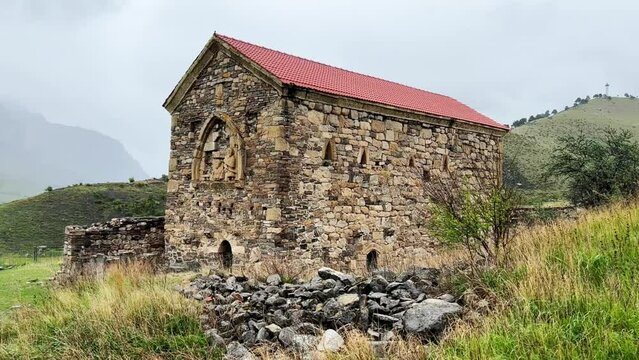 Thaba-Yerdy in Ingushetia. ZEISS, RUSSIA - MAY 19, 2023: Video of the Thaba-Yerdy Temple, the oldest temple in Ingushetia. The Caucasus Mountains. 4K	