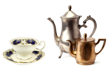 Vintage teapot, coffee pot and porcelain cup and saucer isolated on white. Collage.