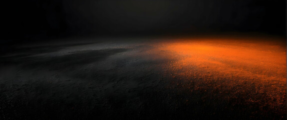 Mysterious dark image with a fiery orange gradient glow on a wet textured floor surface