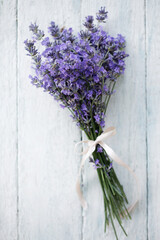 A bouquet of fresh, fragrant lavender on a wooden background