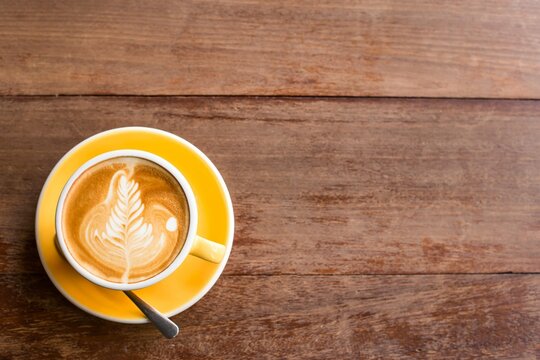 hot-art-latte-coffee-cup-wooden-table