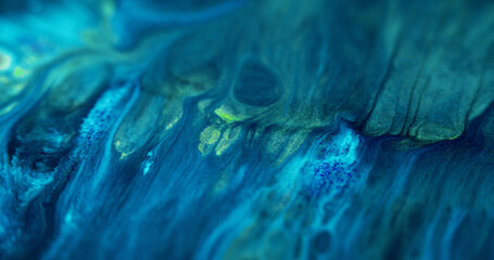 Sparkling ink wave. Acrylic fluid. Defocused blue color shimmering glitter particles wet texture...