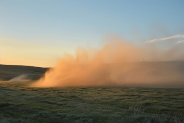 Dust Storm Sweeping Over Golden Twilight Fields