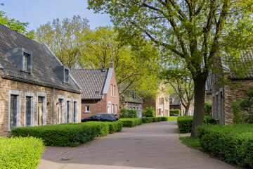 Fototapeta na wymiar Modern small houses in suburban green area Dousberg in Maastricht in The Netherlands