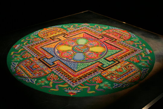 A colorful and vibrant Tibetan mandala made by monks from Tibet