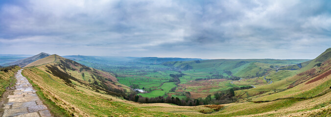 Great ridge hill path and the valley panorama in Peak District park. England
