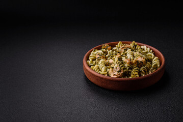 Delicious pasta with spinach, salmon, salt and spices