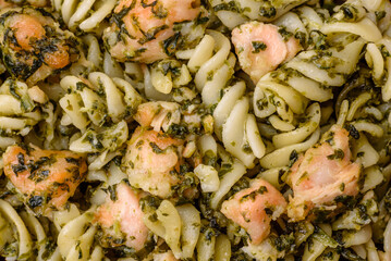 Delicious pasta with spinach, salmon, salt and spices