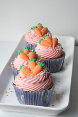 cupcakes with cream and sprinkles