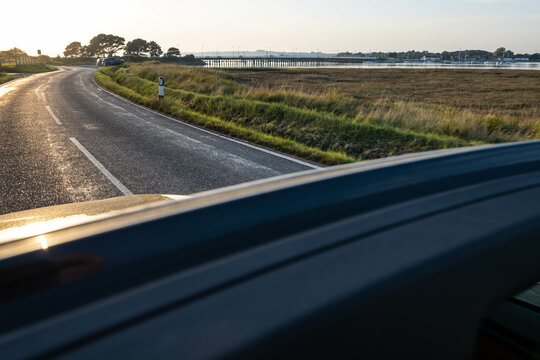 Driving away from Hayling Island in England during sunset in summer