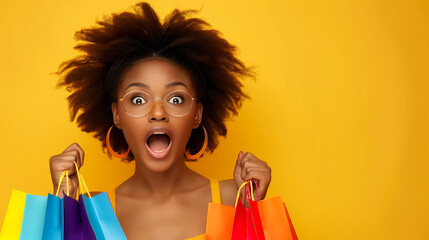 Excited Young african american Woman Holding colorful Shopping Bags on Yellow Sale Concept Background