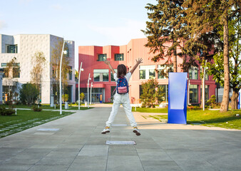 Girl with backpack walking to school