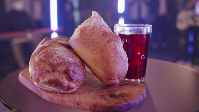bread and wine on table in slow motion easter resurrection