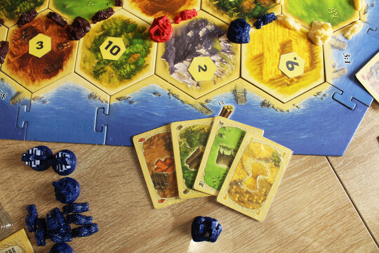 A catan board game buying in the game exchange the resources of hay wheat sheep wood and bricks, clay for a settlement. Rules for buying and building accommodation on the map of settlements